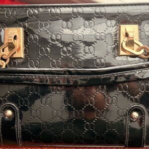 Black Patent Leather Handbag with Gold Accents